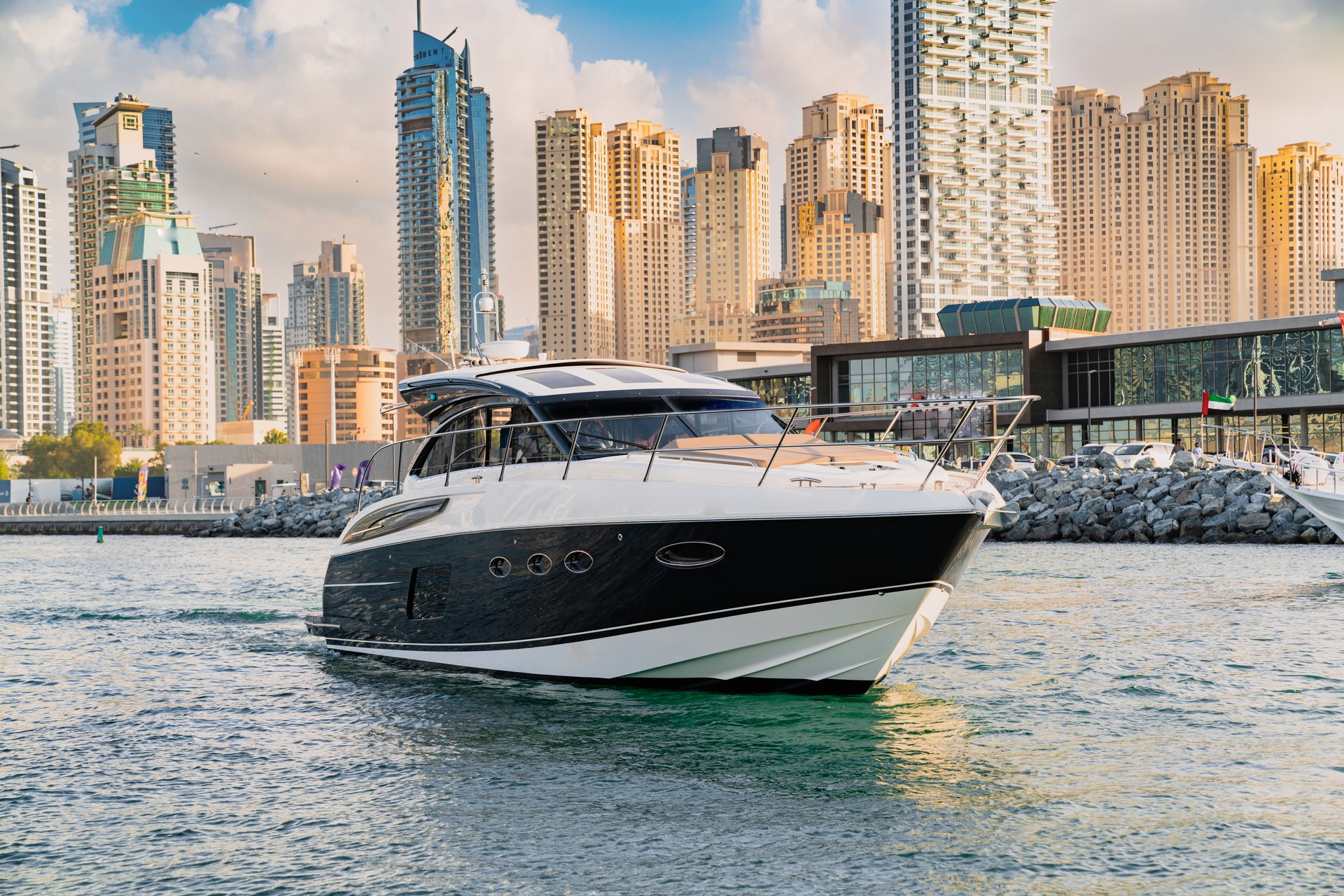 A beautiful luxury yacht in sea with dubai skyline